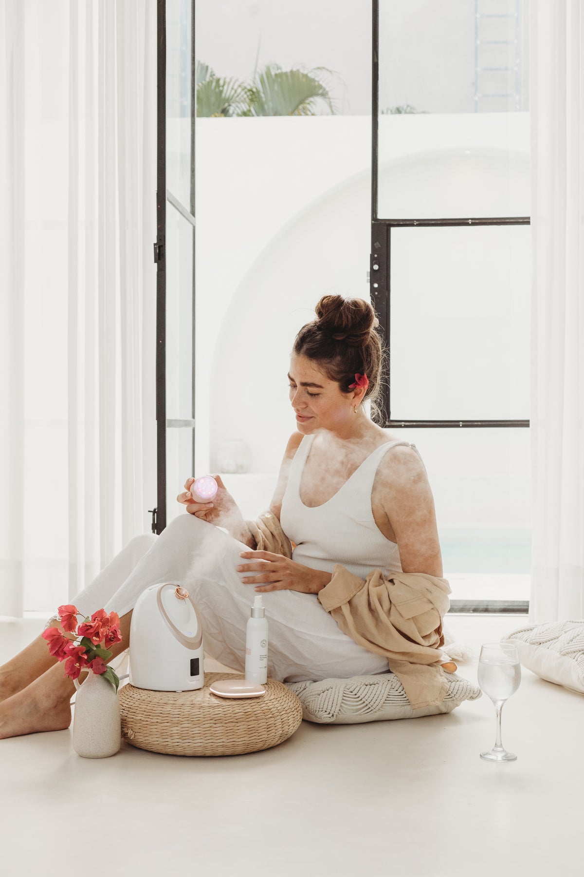 Steam rising, warmth against your skin. Soft red light resting like a quiet glow.